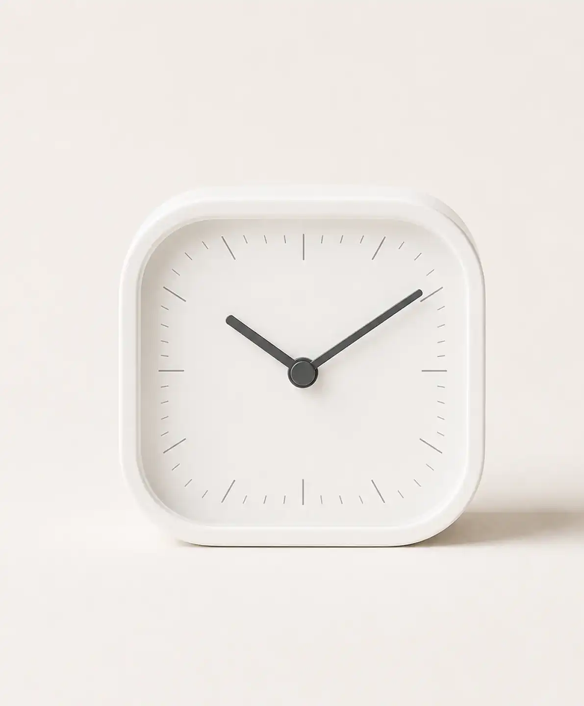Original product photo of a white square alarm clock uploaded to Oneable AI